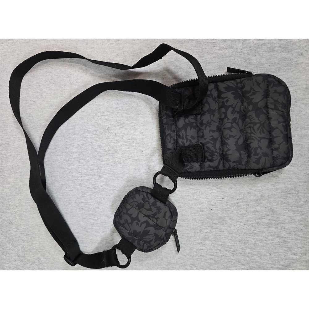 Reebok Women's Eden Quilted Crossbody Bag with a black floral print and a...